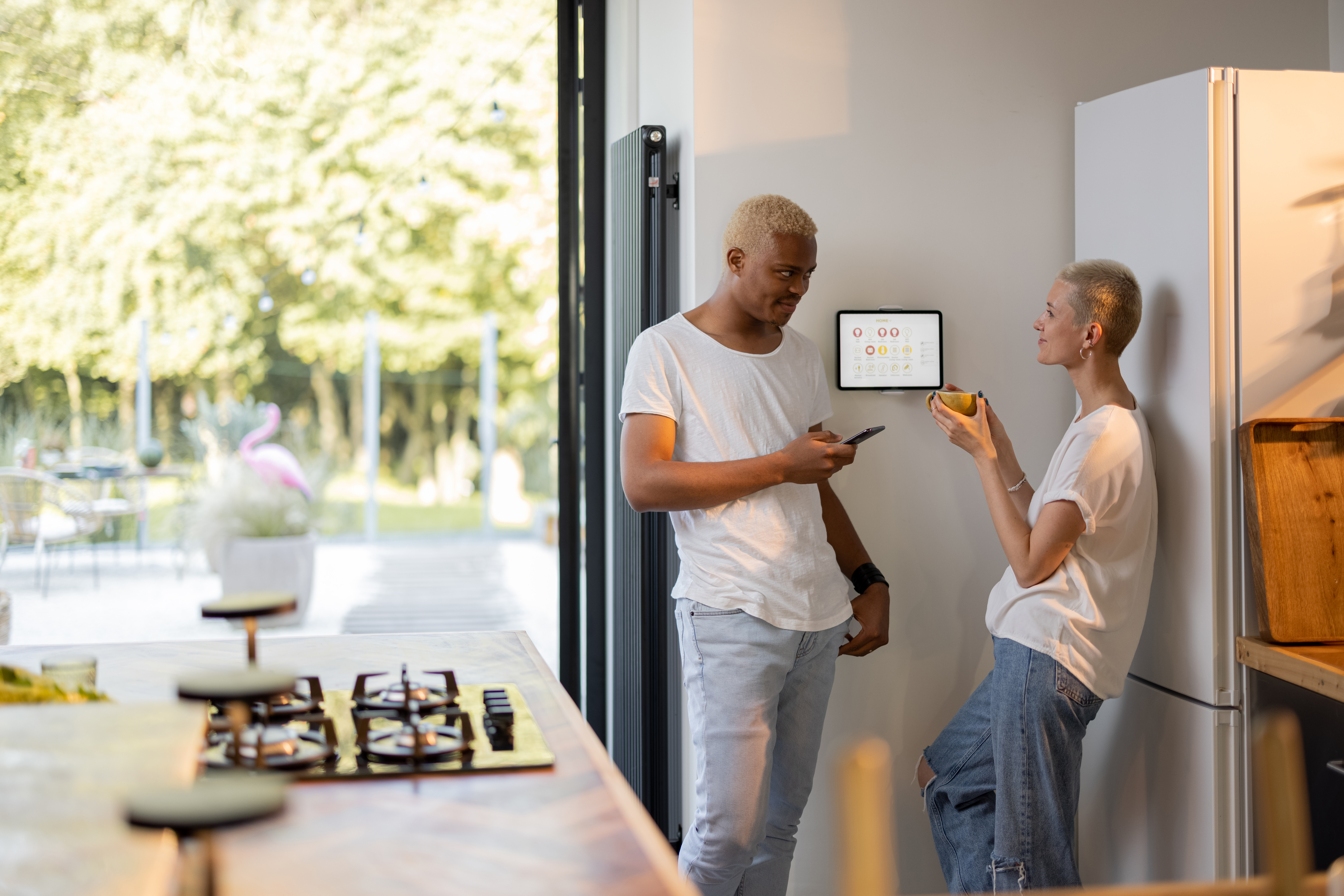 Smart Homes and Home Automation 2 girl choosing temperature on smart home thermostat 2025 03 14 03 37 38 utc