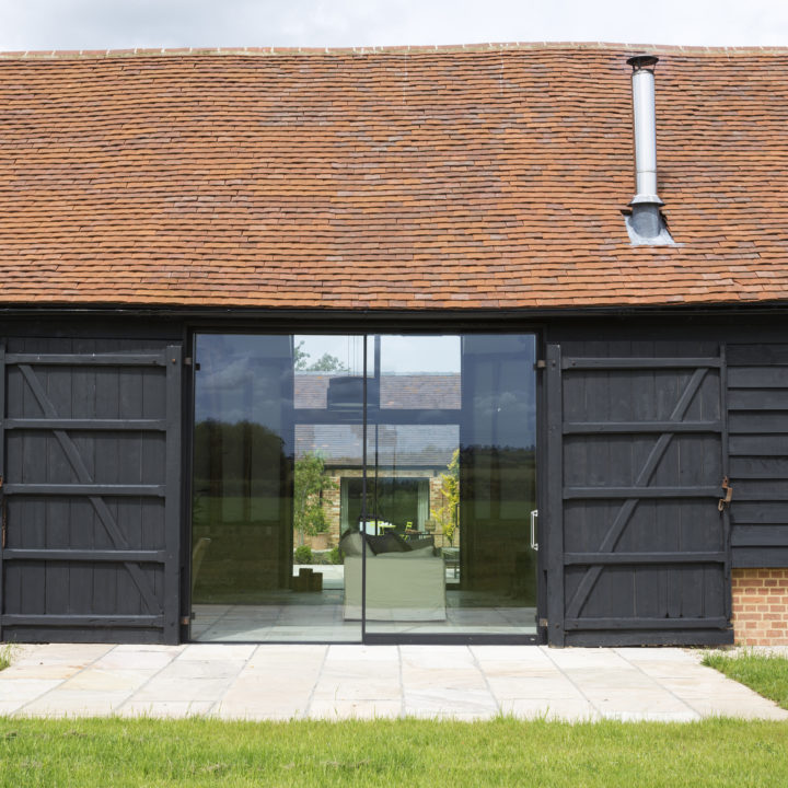 glass sliding doors of converted barn home 2025 04 03 23 28 50 utc1