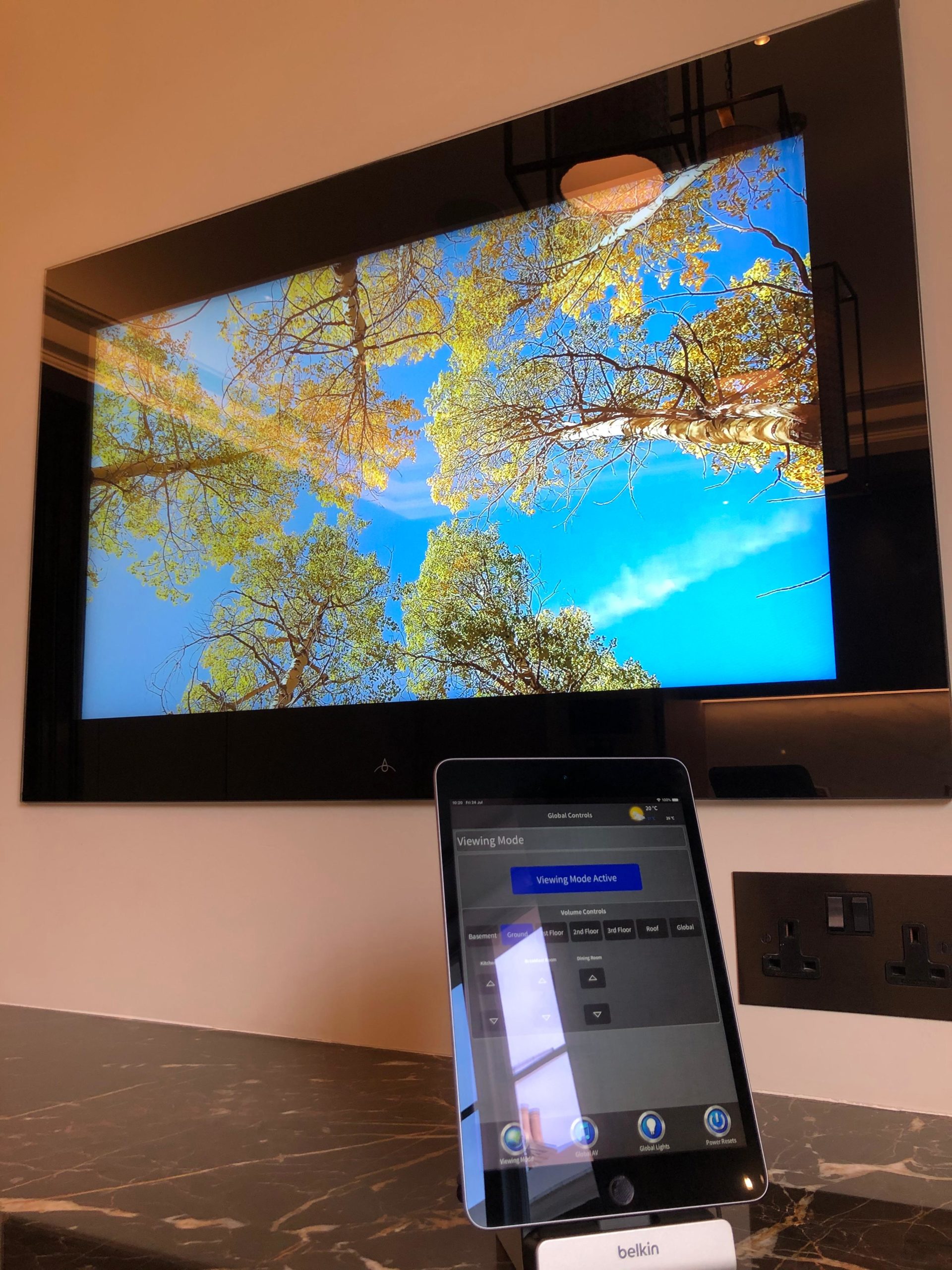 Crestron smart home control on iPad with AquaVision mirror TV installation by Vertex AV London